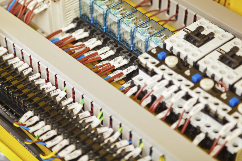 Electrical components switches and wiring in a control panel Electrical components switches and wiring in a control panel.