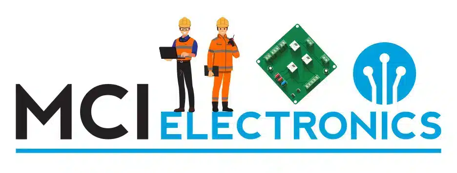 Two engineers, and a circuit on a PCB as part of the 12 days of MCI Electronics Christmas.